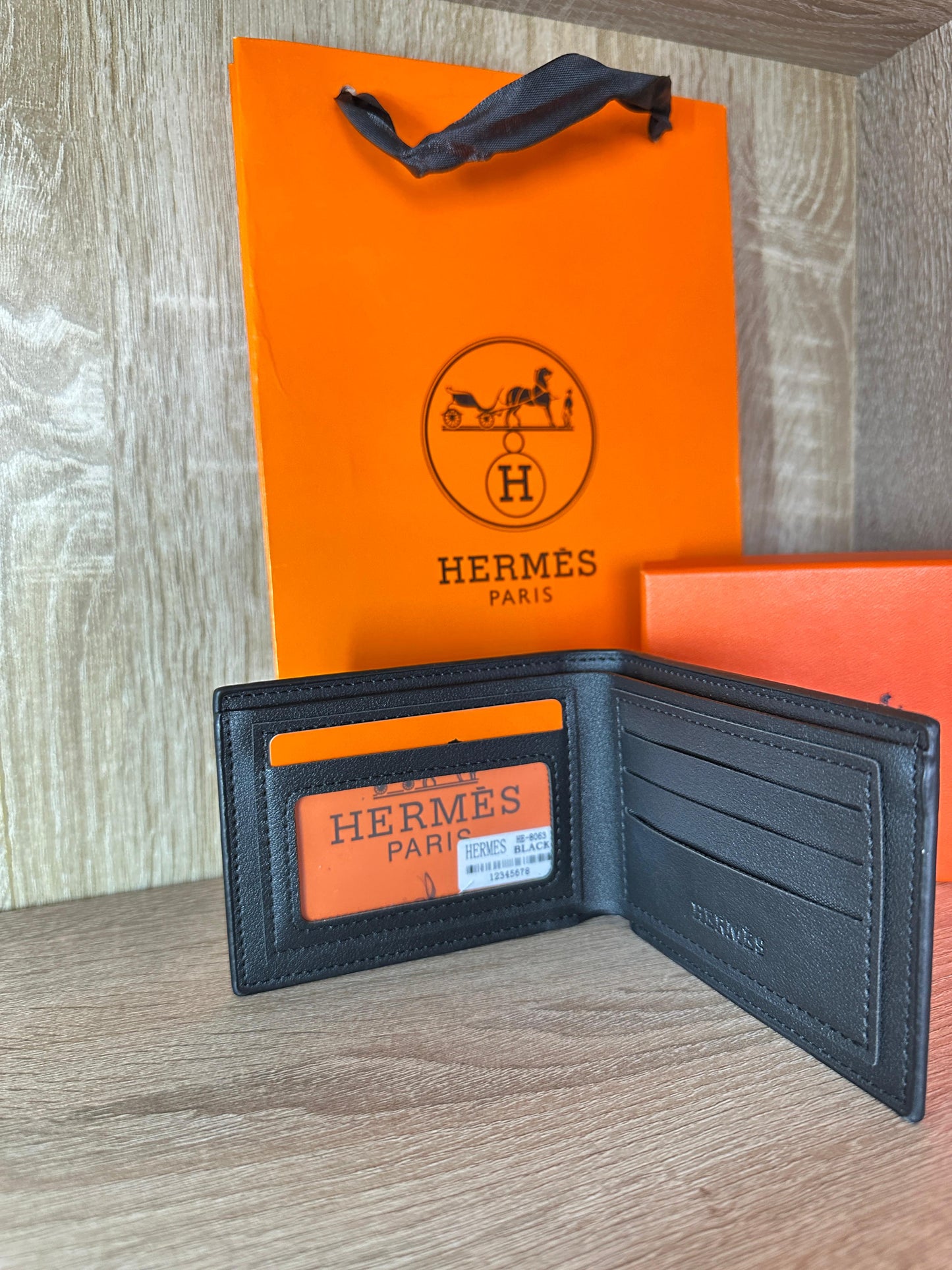 PORTE FEUILLE HERMES NOIR